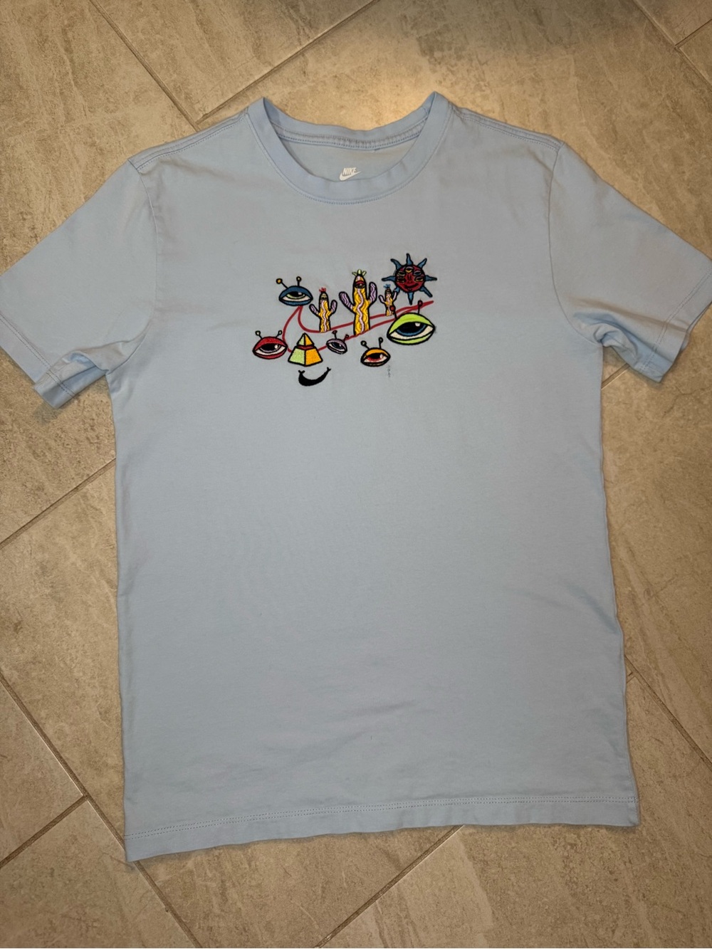 Nike Light Blue Short Sleeve Tee with Colorful Chest Graphic